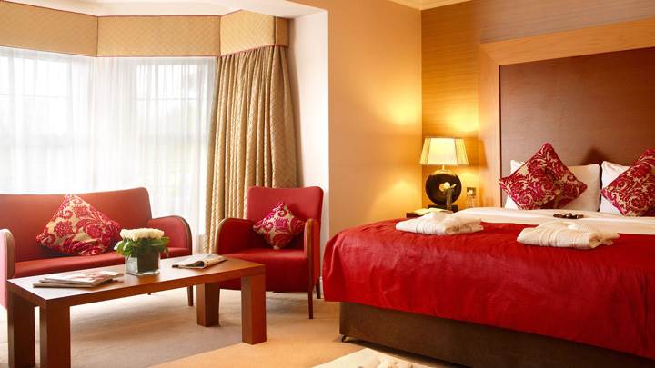 Red Bed And Red Sofa Set And Wooden Color Interior